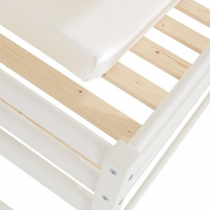close up of wooden junior bed frame and slats with white mattress on a white background
