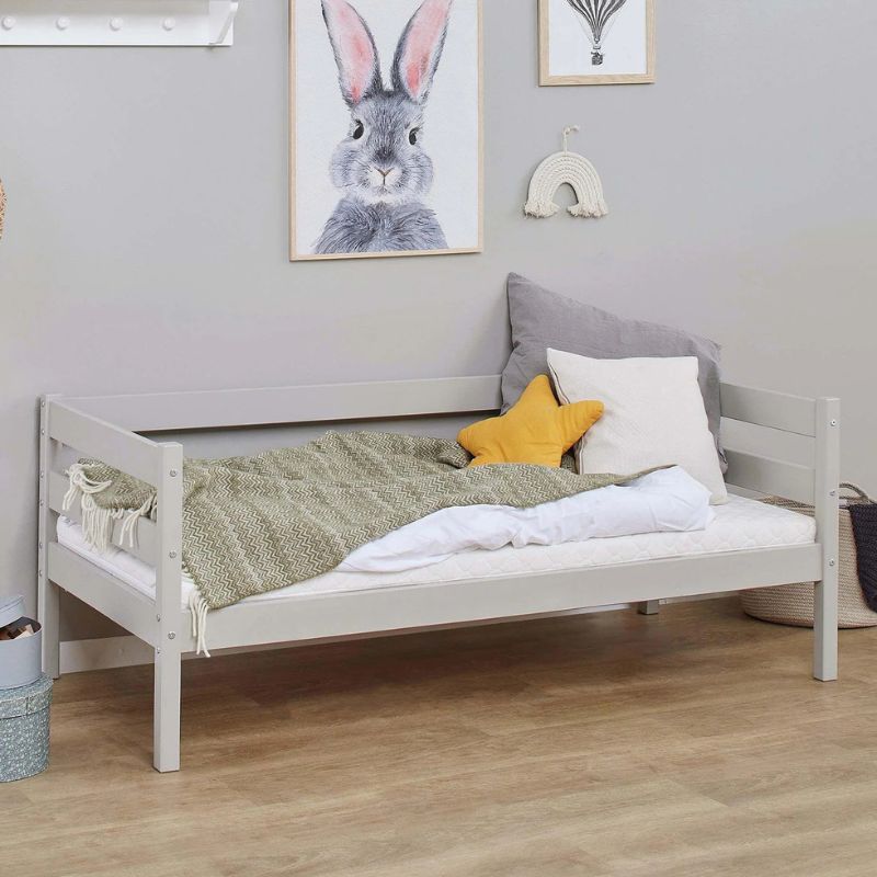 dove grey wooden frame junior bed in  decorated room, angled view