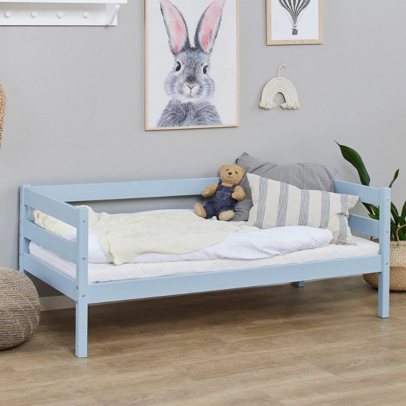 dream. blue wooden frame junior bed in  decorated room, angled view