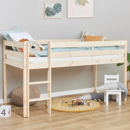 Wooden children's bed in a room with toys and decor