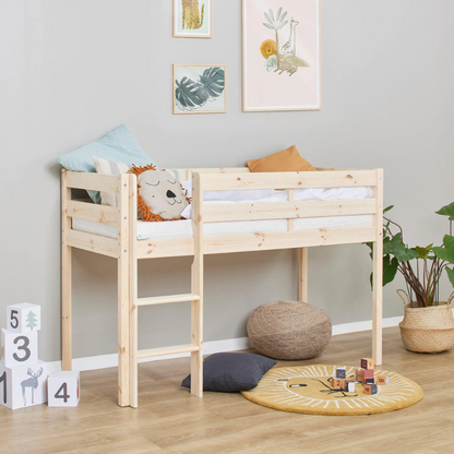 Wooden children's bed in a room with toys and decor