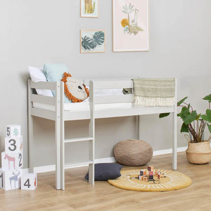 Grey children's bed in a room with toys and decor