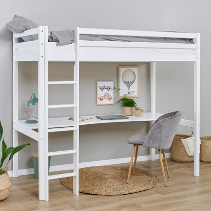 White loft bed with desk and chair in a room with decor elements.