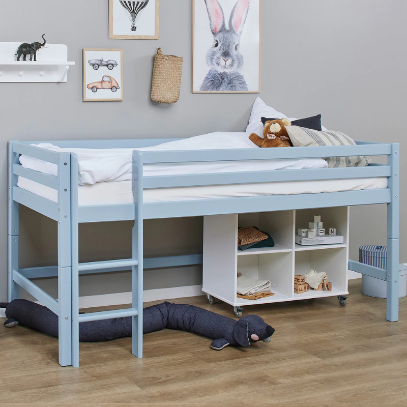 Children's room with a dream blue bunk bed and shelves.