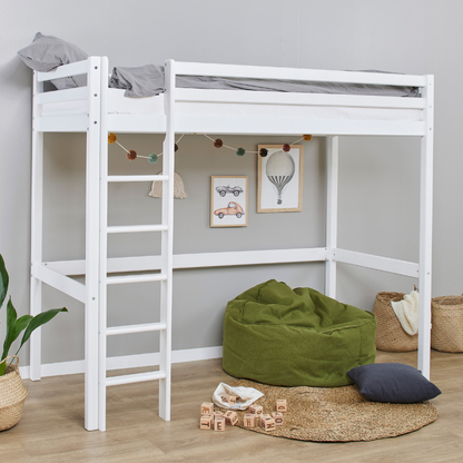 White loft bed with green bean bag and toys in a room with gray walls and wooden floor.
