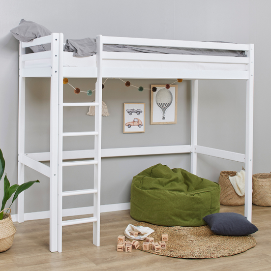 White loft bed with green bean bag and toys in a room with gray walls and wooden floor.