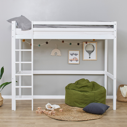 White loft bed with green bean bag and decorative items in a room.