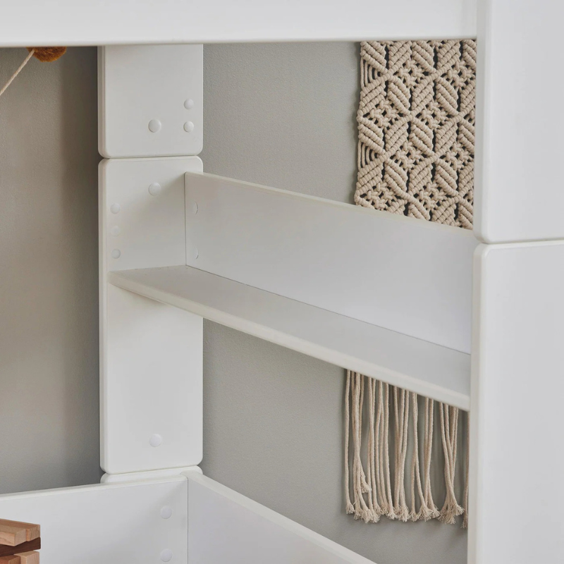 close-up white bedframe showing the modules joining