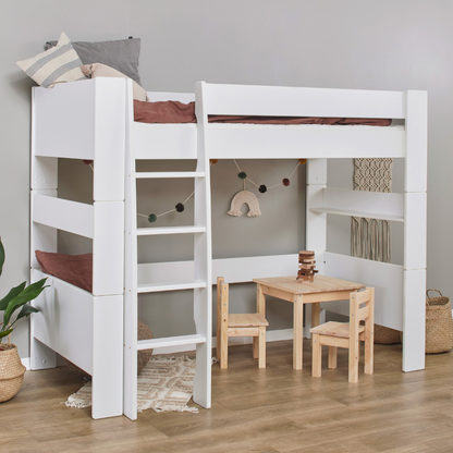 White loft bed with wooden desk and chairs in a room setting
