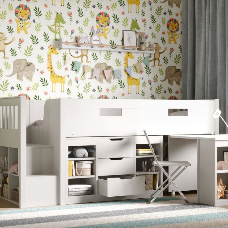 white mid sleeper bed with storage and desk pulled out in children's room with animal-themed wallpaper, white furniture, and decorative items.